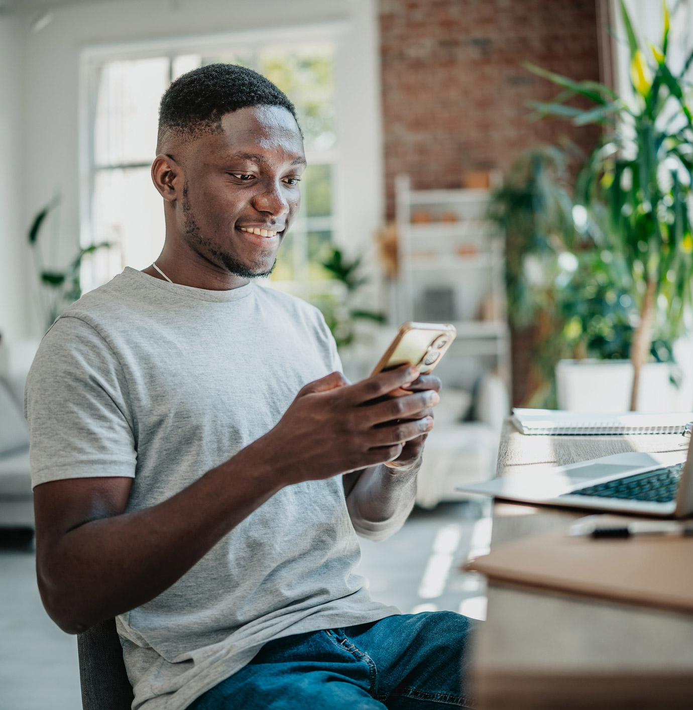 Black Male looking at a phone